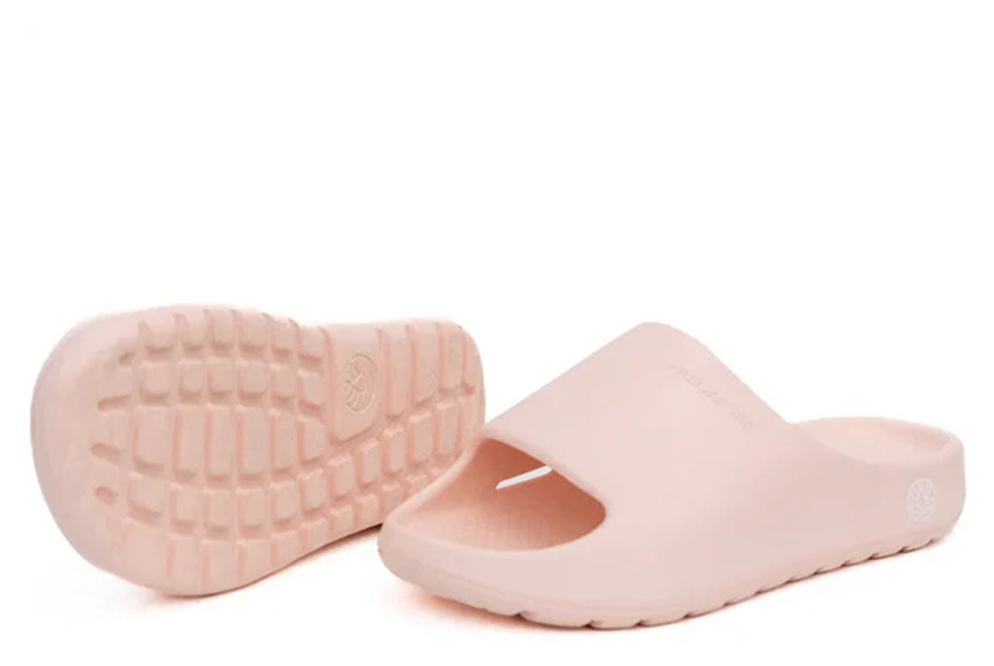 A pink unisex slide sandal with a contoured footbed and a simple, modern design.