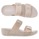 A pair of beige Skyhigh sandals with adjustable buckle straps and a flat sole.