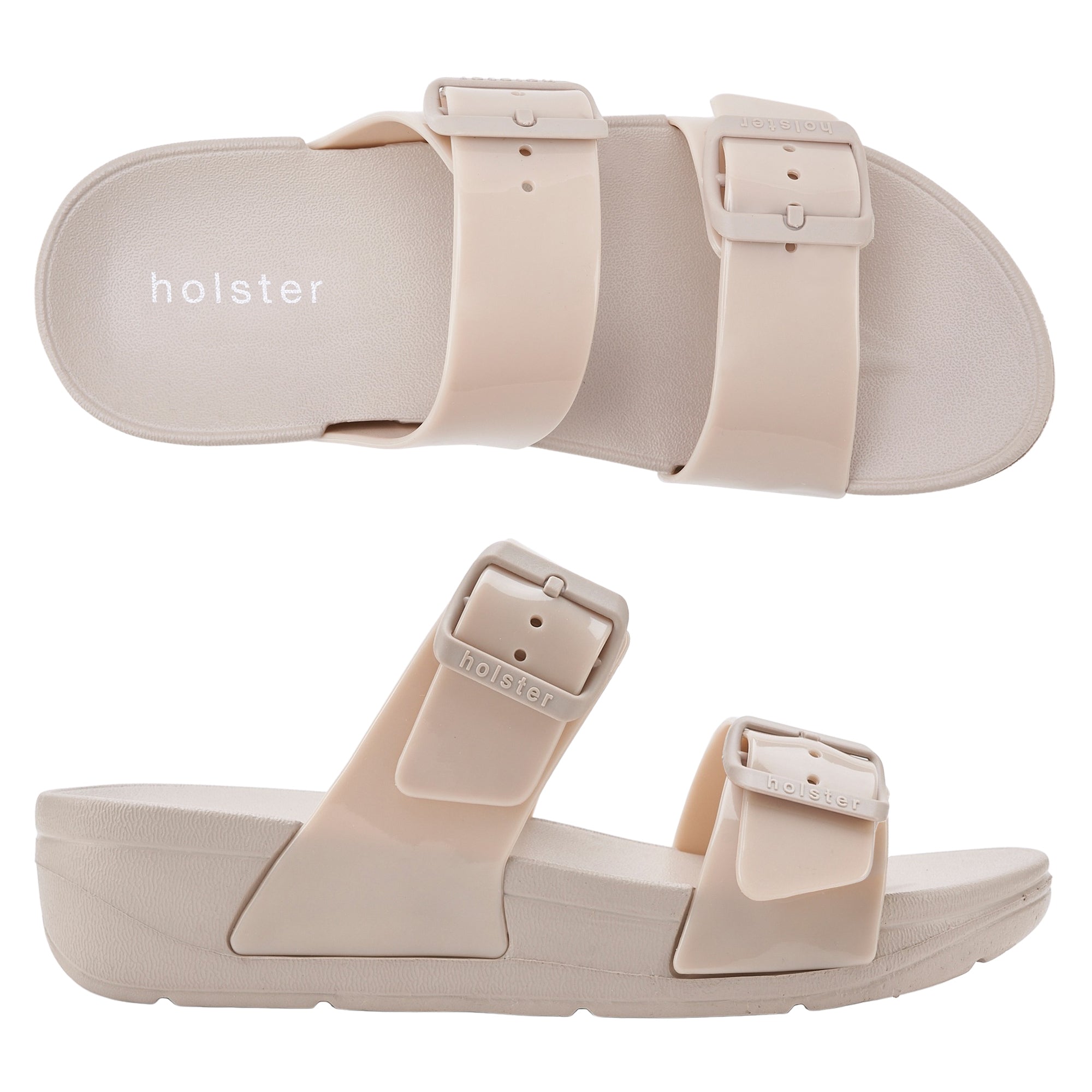 A pair of beige Skyhigh sandals with adjustable buckle straps and a flat sole.