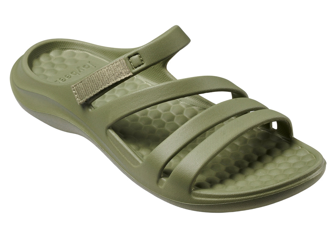 Green sandal with a strap on a white background.