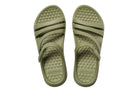 Pair of green sandals with textured sole on a white background