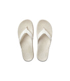 A pair of white sandals with a tropical footbed pattern, designed for women.