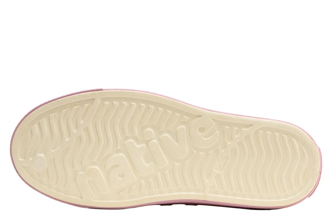 A white outsole of a native shoe.